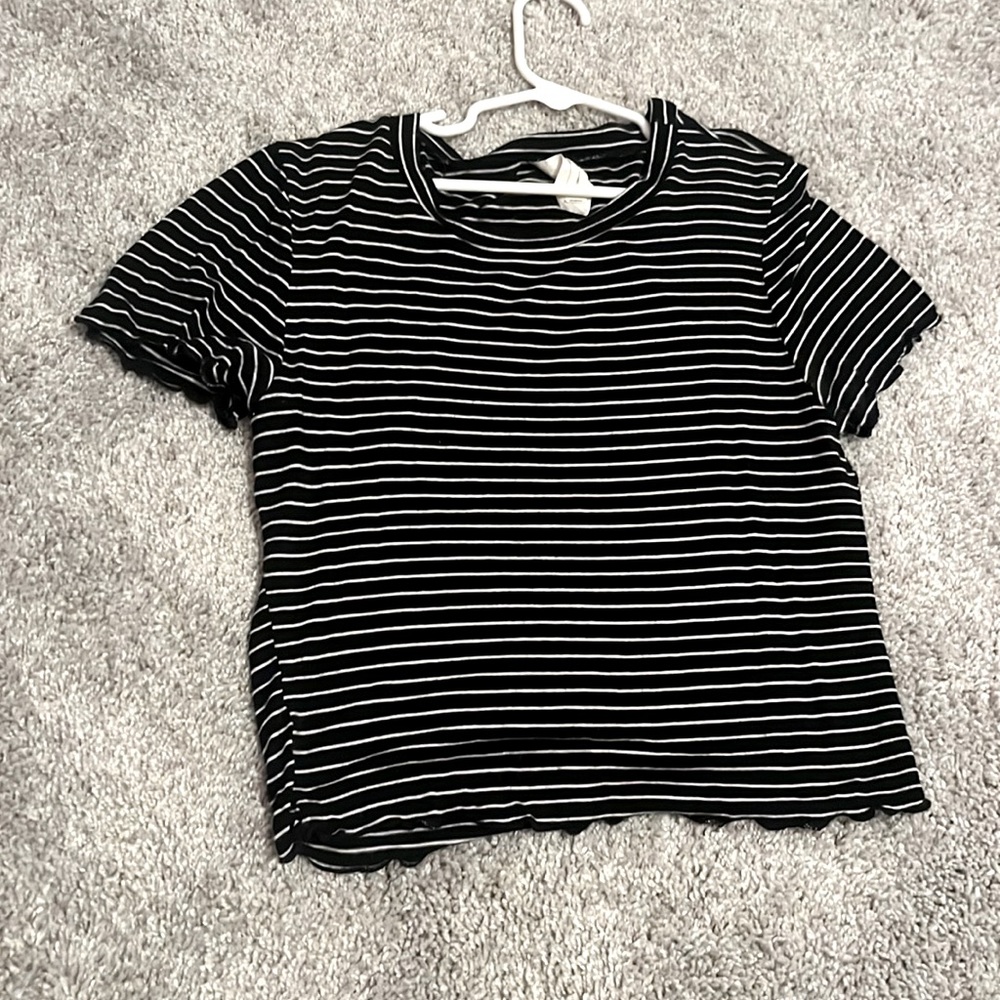 black cropped tee with white stripes.